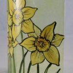 Design detail showing hand-painted daffodil flowers