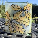 Autumn inspired fused glass gift with oak leaves in orange
