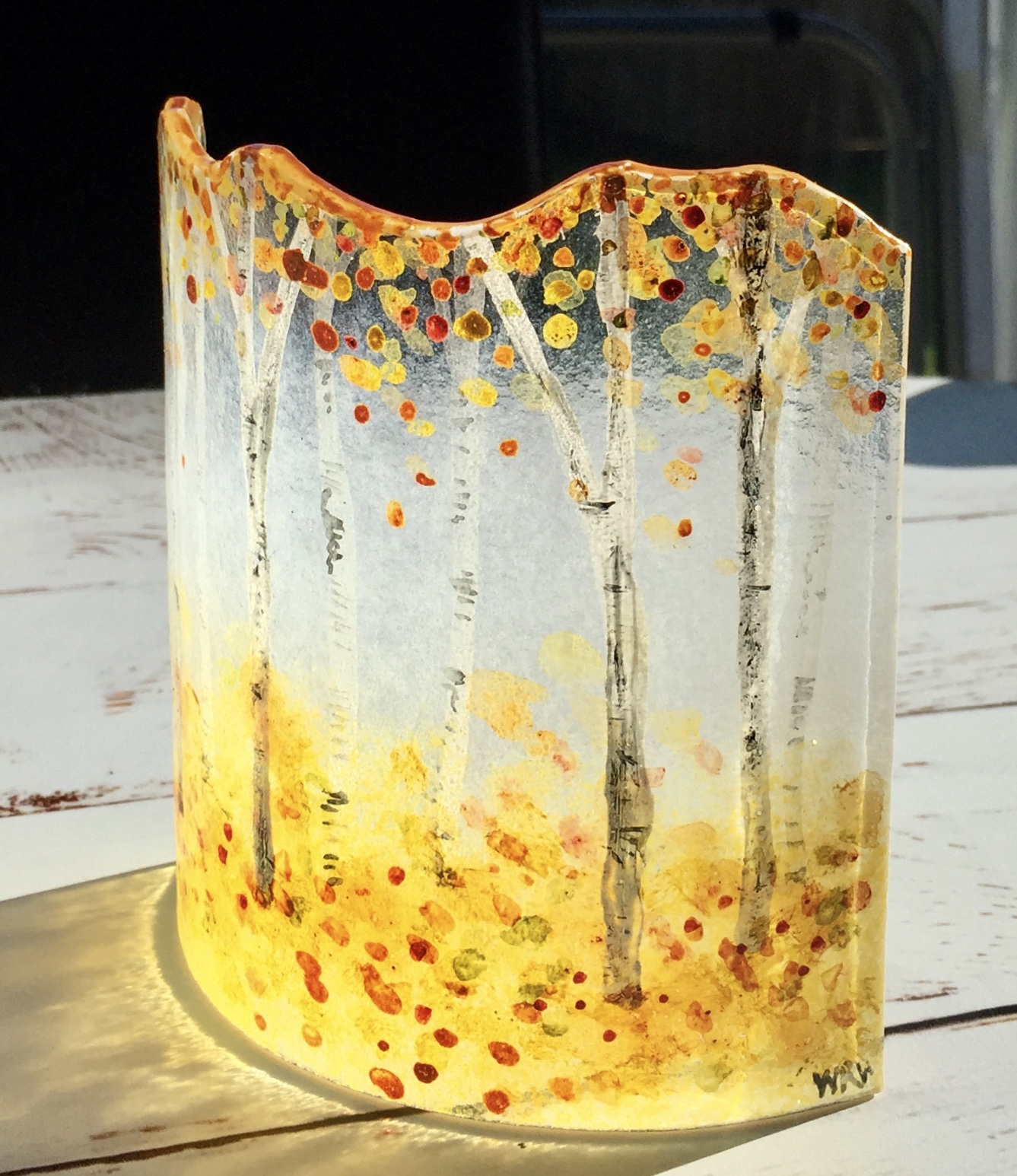 Fused glass hand painted curved panel of birch trees in autumn