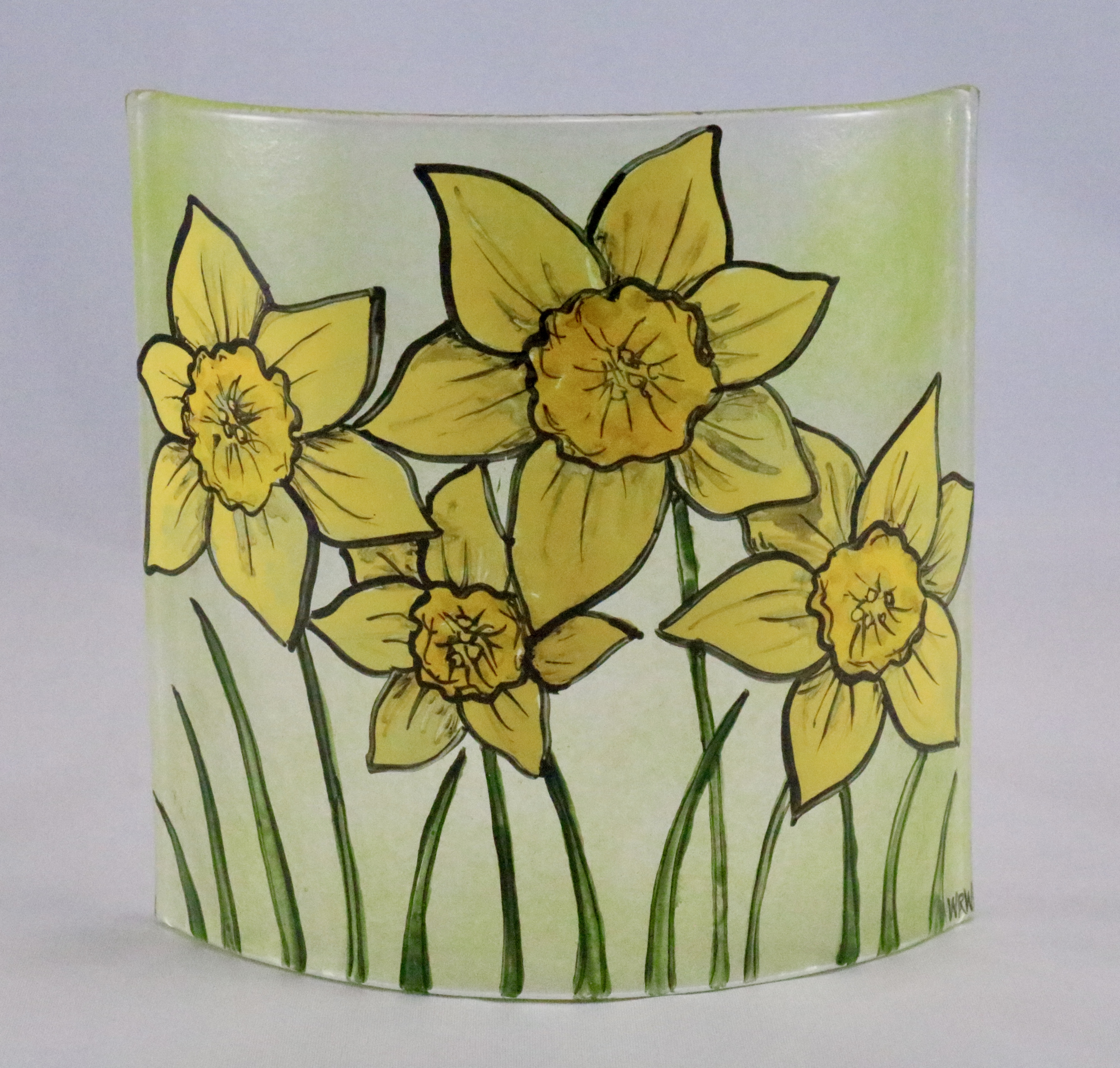 fused glass hand painted curved panel of daffodils on spring green background
