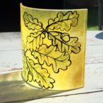 Glass art design with hand-painted oak and acorn design