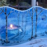 Hand-painted fused glass design with a wintry scene
