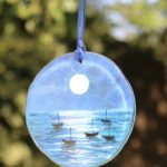 Blue glass suncatcher with moonlit sea design