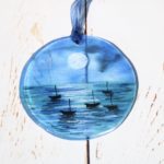 Round glass suncatcher featuring moonlit sea design