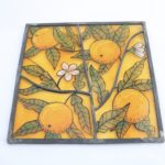 Handmade leaded glass panel with sicilian oranges design on orange background
