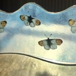 Backlit fused glass panel with orange tip butterflies