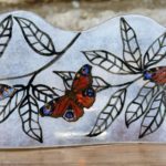 Long fused glass panel with British peacock butterflies on foilage design