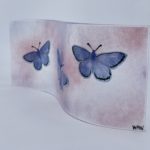 Wavy fused glass panel with common blue butterflies