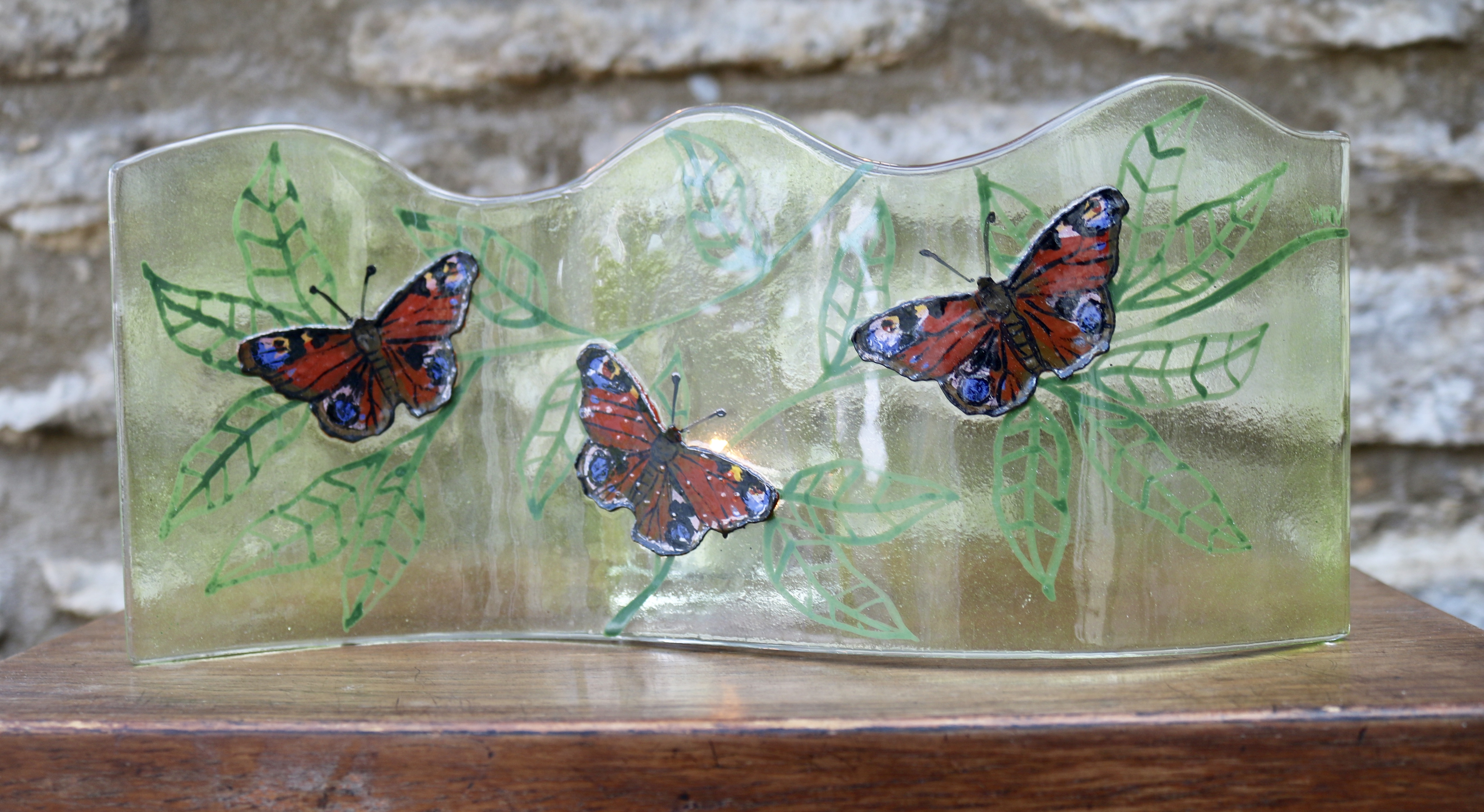 Long wavy fused glass panel with 3 Peacock butterflies