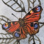 Close up of handmade painted glass peacock butterfly