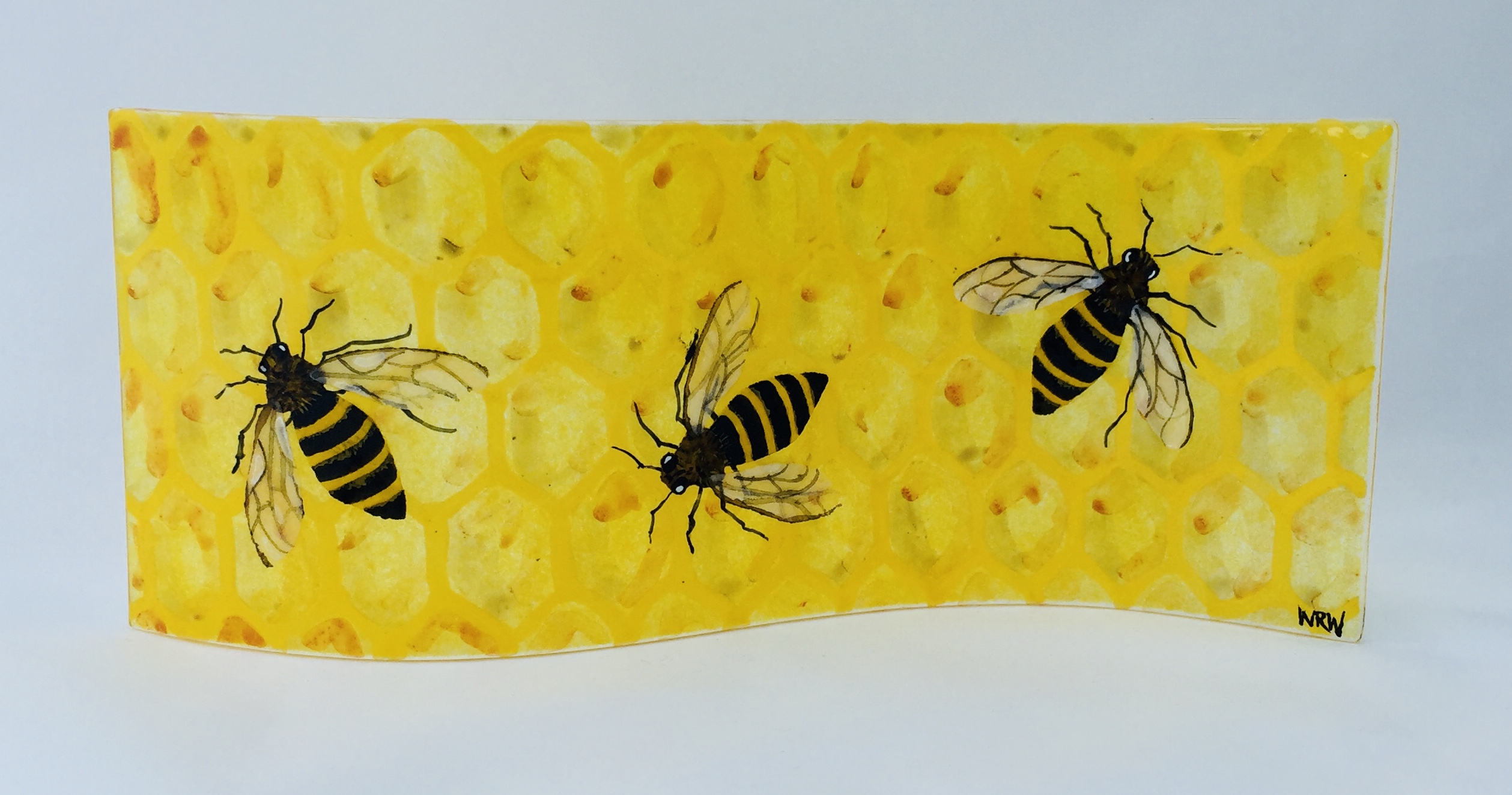 Fused glass panel of honeycomb with bees