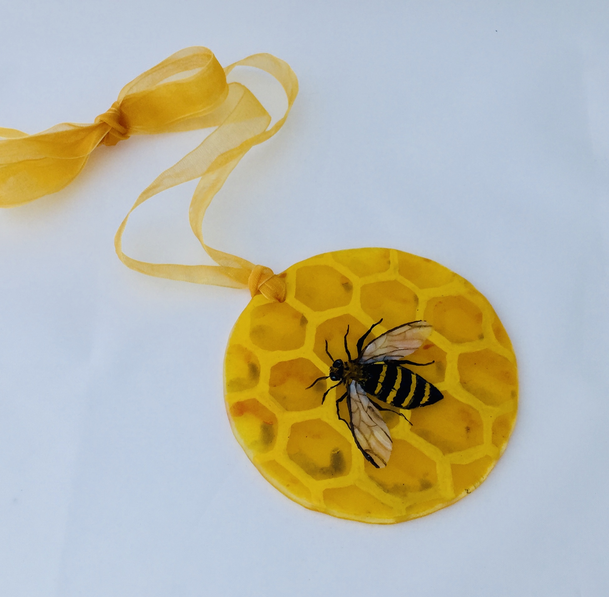 Fused glass hand painted bee on honeycomb suncatcher