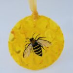 Close up showing the detail of the honeybee fused glass suncatcher