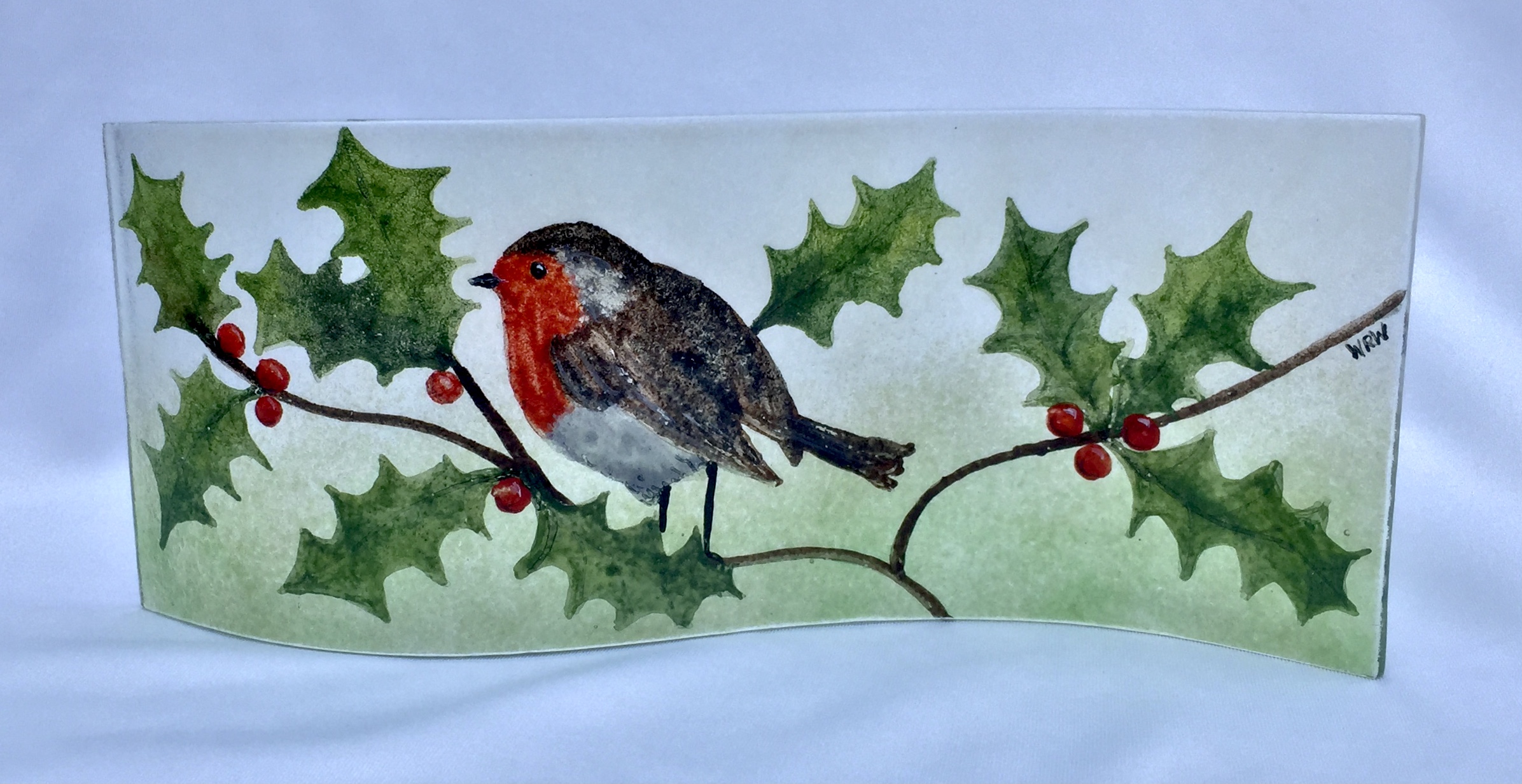 Short fused glass panel featuring a christmas design of a robin on holly